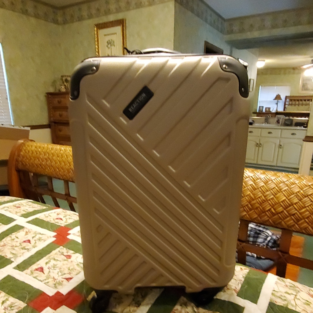 A soft-sided suitcase photographed for a US resale marketplace listing in September 2026